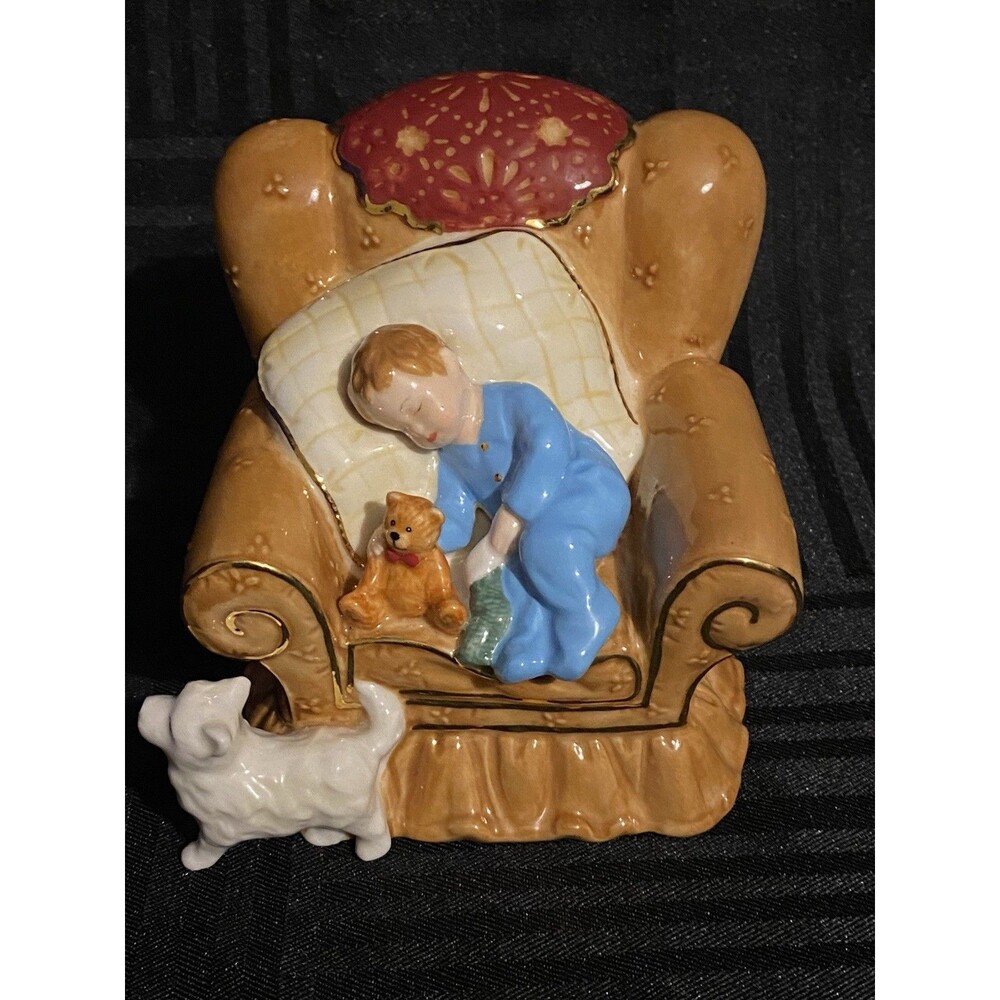 Vintage Boy sleeping in a chair with his bear,dog, and stocking figurine
